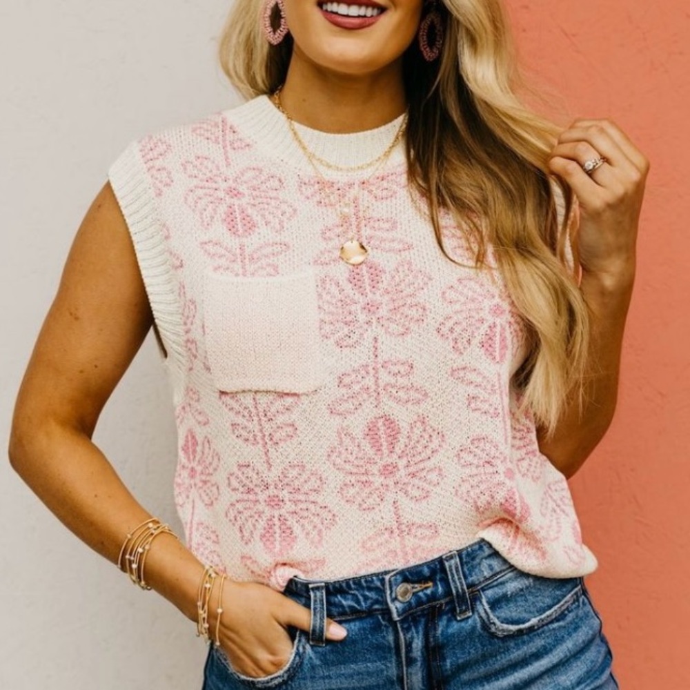 Sleeveless pink and cream patterned sweater